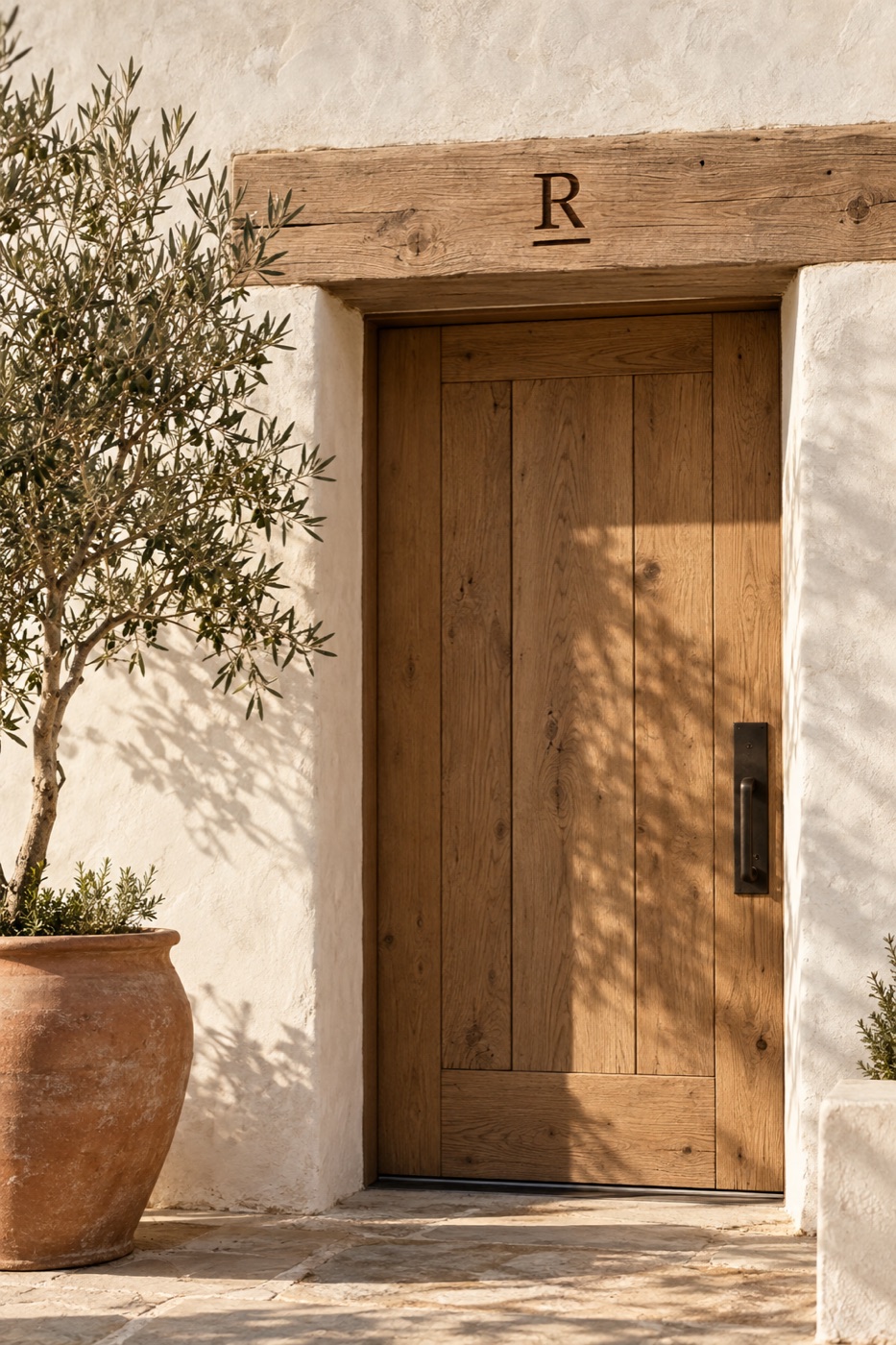 Limewashed wall, oak door, R-bar burned into the beam