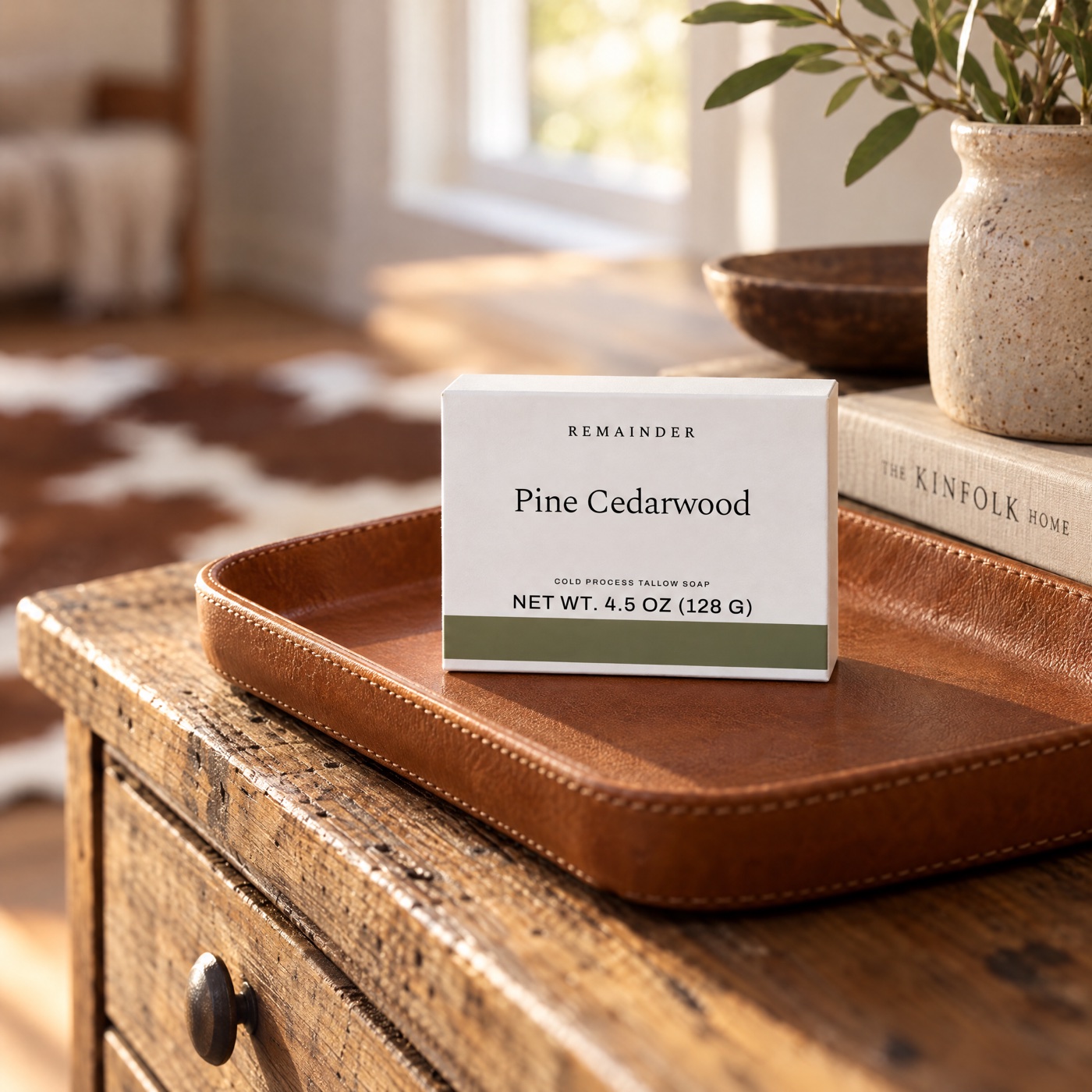 Pine Cedarwood box on a cognac leather tray, cowhide behind